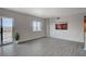 Bright living room features neutral walls, tile flooring, and access to a balcony with city views at 8255 S Las Vegas Blvd # 2004, Las Vegas, NV 89123