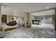 Spacious lounge area with multiple seating options, hardwood floors, and a bar area at 8255 S Las Vegas Blvd # 2004, Las Vegas, NV 89123