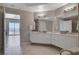 Well-lit main bathroom showcasing double sinks, modern fixtures, and tile flooring at 8255 S Las Vegas Blvd # 2004, Las Vegas, NV 89123