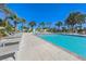 Resort-style swimming pool with lounge chairs surrounded by palm trees at 8255 S Las Vegas Blvd # 2004, Las Vegas, NV 89123