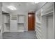Spacious walk-in closet boasting ample shelving, drawers, and wood flooring at 8255 S Las Vegas Blvd # 2004, Las Vegas, NV 89123