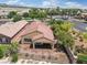 This aerial view showcases the tile roof, covered patio and desert landscaping at 8409 Sherwood Park Dr, Las Vegas, NV 89131