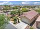 This aerial view showcases the desert landscaping, mature trees and mountain views at 8409 Sherwood Park Dr, Las Vegas, NV 89131