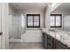 Bright bathroom with walk-in shower, soaking tub, granite counters, and tiled floors at 8409 Sherwood Park Dr, Las Vegas, NV 89131