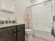 Cozy bathroom with granite countertops, a tiled tub, and modern fixtures at 8409 Sherwood Park Dr, Las Vegas, NV 89131
