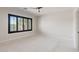A bedroom featuring a neutral color palette, carpeted flooring, and a large window with shutters at 8409 Sherwood Park Dr, Las Vegas, NV 89131