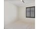 Bright bedroom featuring a neutral color palette, carpeted flooring, and a large window with shutters at 8409 Sherwood Park Dr, Las Vegas, NV 89131