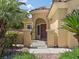 Gated courtyard with desert landscaping leading to the home's front door at 8409 Sherwood Park Dr, Las Vegas, NV 89131