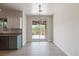 Sun-drenched dining area with sliding glass doors leading to the backyard at 8409 Sherwood Park Dr, Las Vegas, NV 89131
