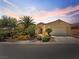 Single-story home with desert landscaping, a gated courtyard and two-car garage at 8409 Sherwood Park Dr, Las Vegas, NV 89131