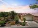 Single-story home with beautiful desert landscaping, gated courtyard and a two-car garage at 8409 Sherwood Park Dr, Las Vegas, NV 89131