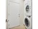 Convenient laundry area equipped with stacked washer and dryer at 8409 Sherwood Park Dr, Las Vegas, NV 89131