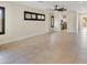 Open-concept living room with tile floors and dark windows provides a seamless flow at 8409 Sherwood Park Dr, Las Vegas, NV 89131