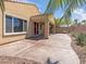 Relaxing covered patio with a stamped concrete floor and desert landscaping at 8409 Sherwood Park Dr, Las Vegas, NV 89131