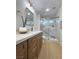 Bathroom featuring a walk-in shower with marble walls and a single vanity at 9369 Villa Ridge Dr, Las Vegas, NV 89134