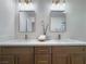 Modern bathroom with a double vanity and updated lighting fixtures at 9369 Villa Ridge Dr, Las Vegas, NV 89134