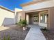 Exterior view of home with well maintained desert landscaping at 9369 Villa Ridge Dr, Las Vegas, NV 89134