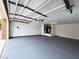Clean two-car garage with painted floor and utility connections at 9369 Villa Ridge Dr, Las Vegas, NV 89134
