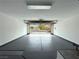 Clean two-car garage with painted floor and open door to the street at 9369 Villa Ridge Dr, Las Vegas, NV 89134