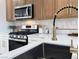 Bright kitchen featuring stainless steel appliances and a new faucet at 9369 Villa Ridge Dr, Las Vegas, NV 89134