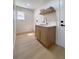 Bright laundry room featuring stylish cabinets, a sink, and modern finishes at 9369 Villa Ridge Dr, Las Vegas, NV 89134
