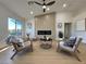 Contemporary living room with stylish decor, electric fireplace, and lots of natural light at 9369 Villa Ridge Dr, Las Vegas, NV 89134