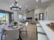Modern open concept kitchen, dining and living area featuring bright interiors, and a cozy fireplace wall at 9369 Villa Ridge Dr, Las Vegas, NV 89134