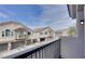Balcony view of neighboring townhomes in a well-maintained community at 9994 Government Point Way # 101, Las Vegas, NV 89183