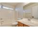 Clean bathroom featuring a vanity sink, toilet, and tub with shower at 9994 Government Point Way # 101, Las Vegas, NV 89183