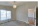 Bedroom featuring soft carpet, a chandelier, and a bright, airy feel at 9994 Government Point Way # 101, Las Vegas, NV 89183