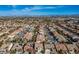 Aerial view of the home in a residential neighborhood with city views and desert landscape at , Las Vegas, NV 89117