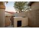 Backyard with gravel landscaping and an outdoor grill area at , Las Vegas, NV 89117