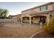 Expansive backyard featuring a covered patio, seating area, and minimalistic landscaping at , Las Vegas, NV 89117