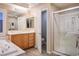 Bright bathroom featuring a walk-in glass shower, modern vanity, and marble accents, offering a luxurious spa-like experience at , Las Vegas, NV 89117