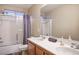Clean bathroom featuring a double sink vanity and shower/tub combo with sleek, modern finishes and fixtures at , Las Vegas, NV 89117
