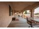 Spacious covered patio with tile flooring and seating area, perfect for outdoor relaxation and dining at , Las Vegas, NV 89117