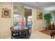 Bright dining area with a glass-top table and patio access, complemented by tiled flooring and a cozy ambiance at , Las Vegas, NV 89117