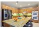 Spacious kitchen featuring a large island with seating, granite countertops, and stainless steel appliances at , Las Vegas, NV 89117