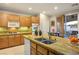 Well-lit kitchen with a spacious island, granite countertops, and stainless steel appliances, ideal for cooking and entertaining at , Las Vegas, NV 89117