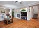 Bright living room with a fireplace, comfortable seating, and stairs leading to the second floor at , Las Vegas, NV 89117