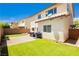 A well-maintained backyard with artificial turf, a gravel area, and a paved patio for outdoor enjoyment at , Las Vegas, NV 89178