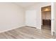 Empty bedroom with closet and gray wood-look flooring, ready for your personal touch and design at , Las Vegas, NV 89178