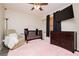 Comfortable Bedroom with a crib, chair, dresser, and a soft pink rug, all under a ceiling fan with lights at , Las Vegas, NV 89178