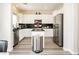 Modern kitchen with white cabinetry, stainless steel appliances, and a functional center island at , Las Vegas, NV 89178