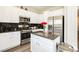 Modern kitchen featuring white cabinetry, stainless steel appliances, granite countertops and a kitchen island at , Las Vegas, NV 89178
