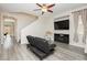 Cozy living room featuring modern flooring, a ceiling fan, large TV, and comfortable seating at , Las Vegas, NV 89178