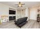 Inviting living room with recessed lighting, large TV, futon, and bright natural light at , Las Vegas, NV 89178