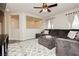 Comfortable living room area featuring a sectional sofa, overhead fan, and neutral decor at , Las Vegas, NV 89178