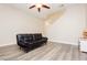 Minimalist living room with light colored walls, modern flooring, and a simple futon at , Las Vegas, NV 89178