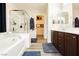 Bright main bathroom featuring a glass enclosed shower, soaking tub and dual sink vanity at , Las Vegas, NV 89178